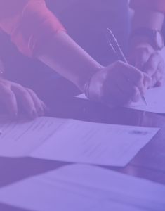 Image: A group of individuals diligently jotting down notes and reviewing documents on paper, symbolizing a thorough examination of requirements for NEN 7510 standards compliance.