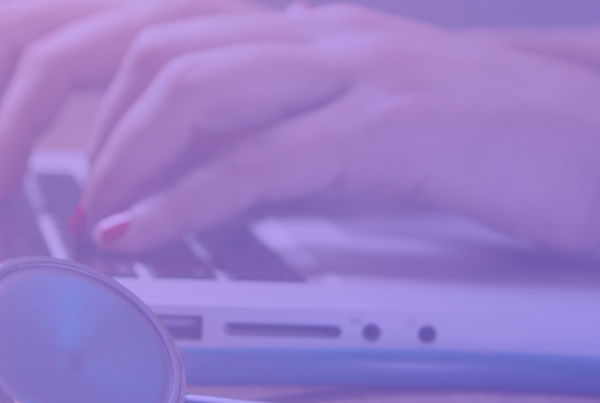 Image: A nurse uses a computer to access and manage client data while ensuring compliance with NEN 7510 standards, ensuring the security and confidentiality of patient information.