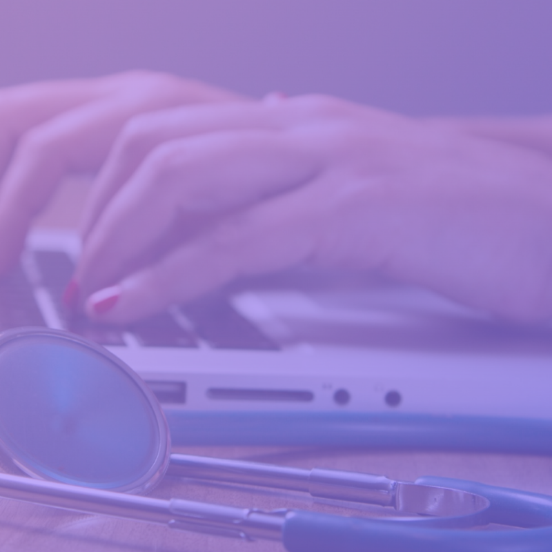 Image: A nurse uses a computer to access and manage client data while ensuring compliance with NEN 7510 standards, ensuring the security and confidentiality of patient information.